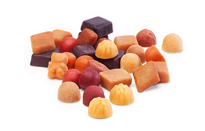 Paradise Fruits Blog Una mezcla de gomas de frutas vitaminadas de diversas formas y colores.